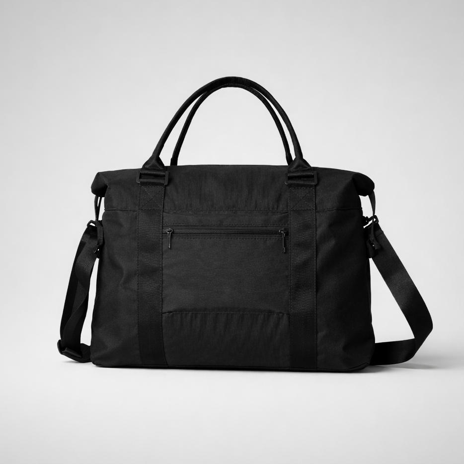 Black nylon travel bag with intention featuring rolled top handles and adjustable shoulder strap for easy carrying