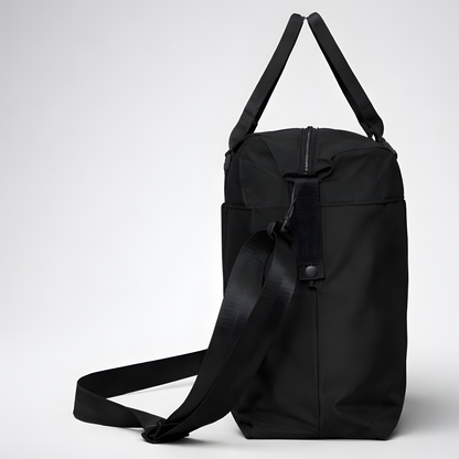 Black nylon travel bag with intention duffel bag featuring adjustable shoulder strap and top handles for easy carrying