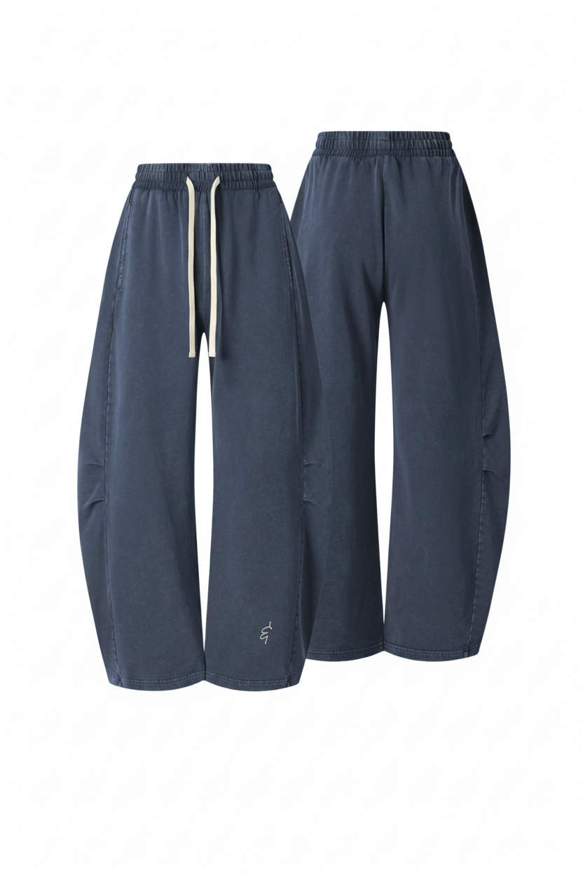 A pair of wide-leg, balloon-style pants in a muted slate blue-gray color, shown from both the front and back angles against a plain white background.