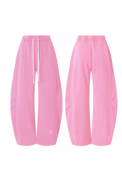 A pair of pink wide-leg jogger pants shown from both the front and back angles on a plain white background.