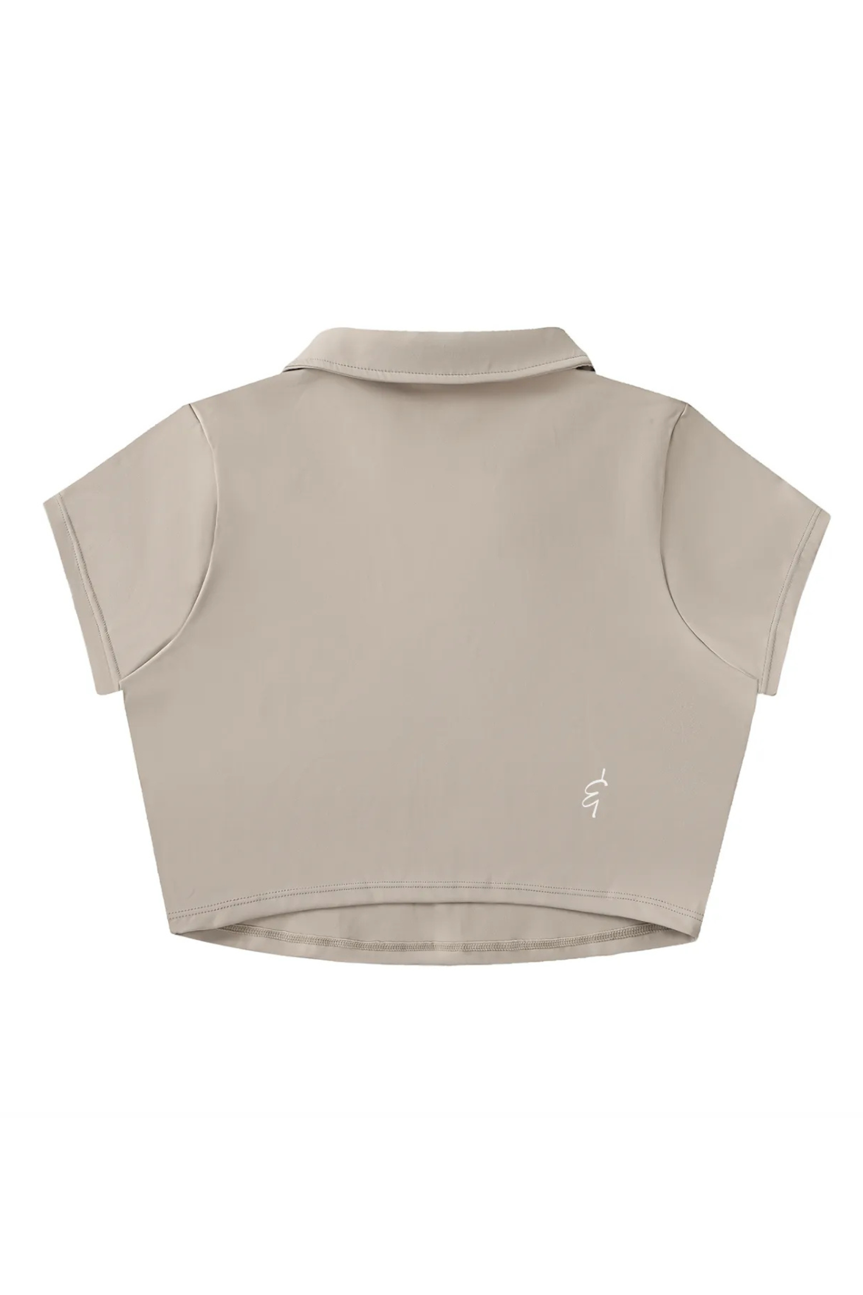 Beige sleeveless crop top with collar on a white background