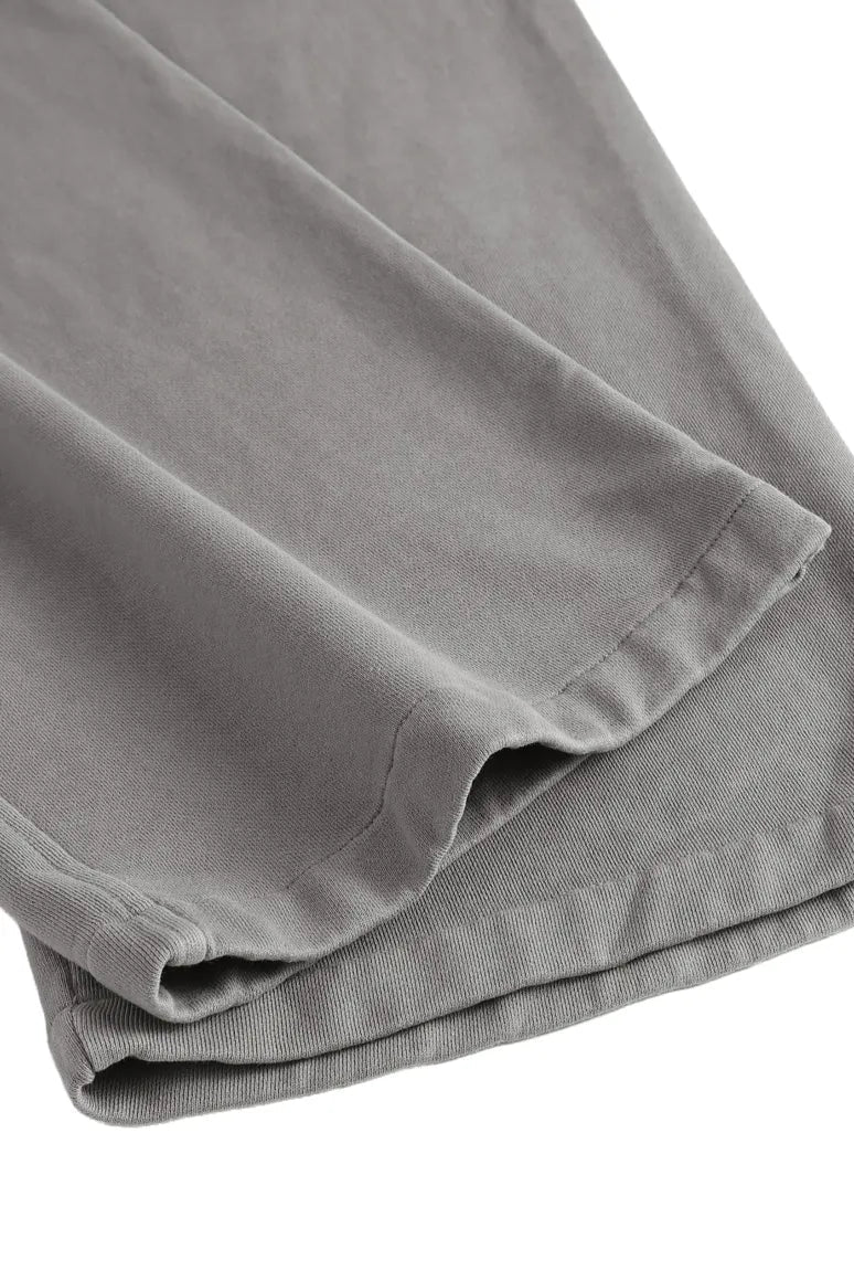 Wide leg sweatpants in gray corduroy with soft textured fabric and neatly stitched hems for comfortable wear