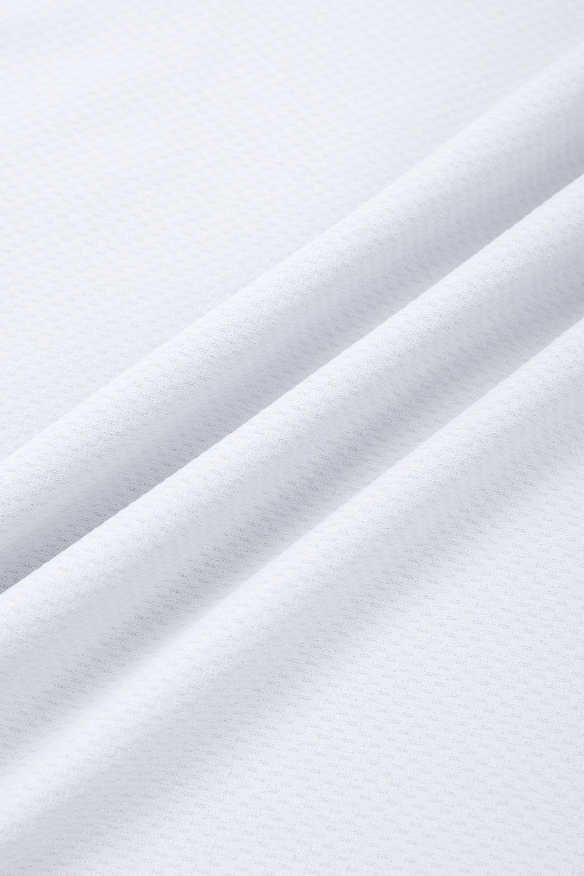Close-up of white fabric with folds