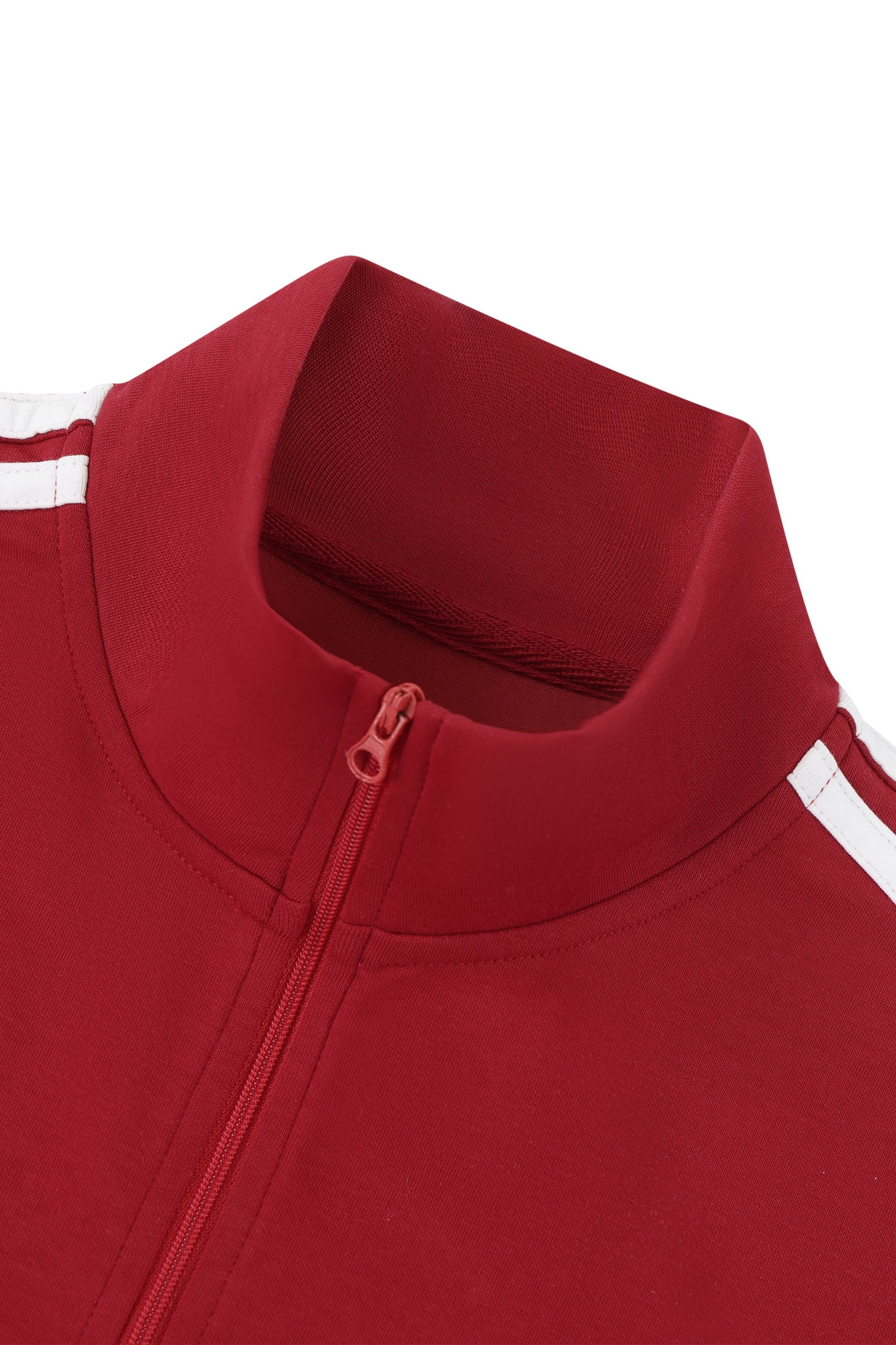 Close-up of a red tracksuit with white stripes on a white background