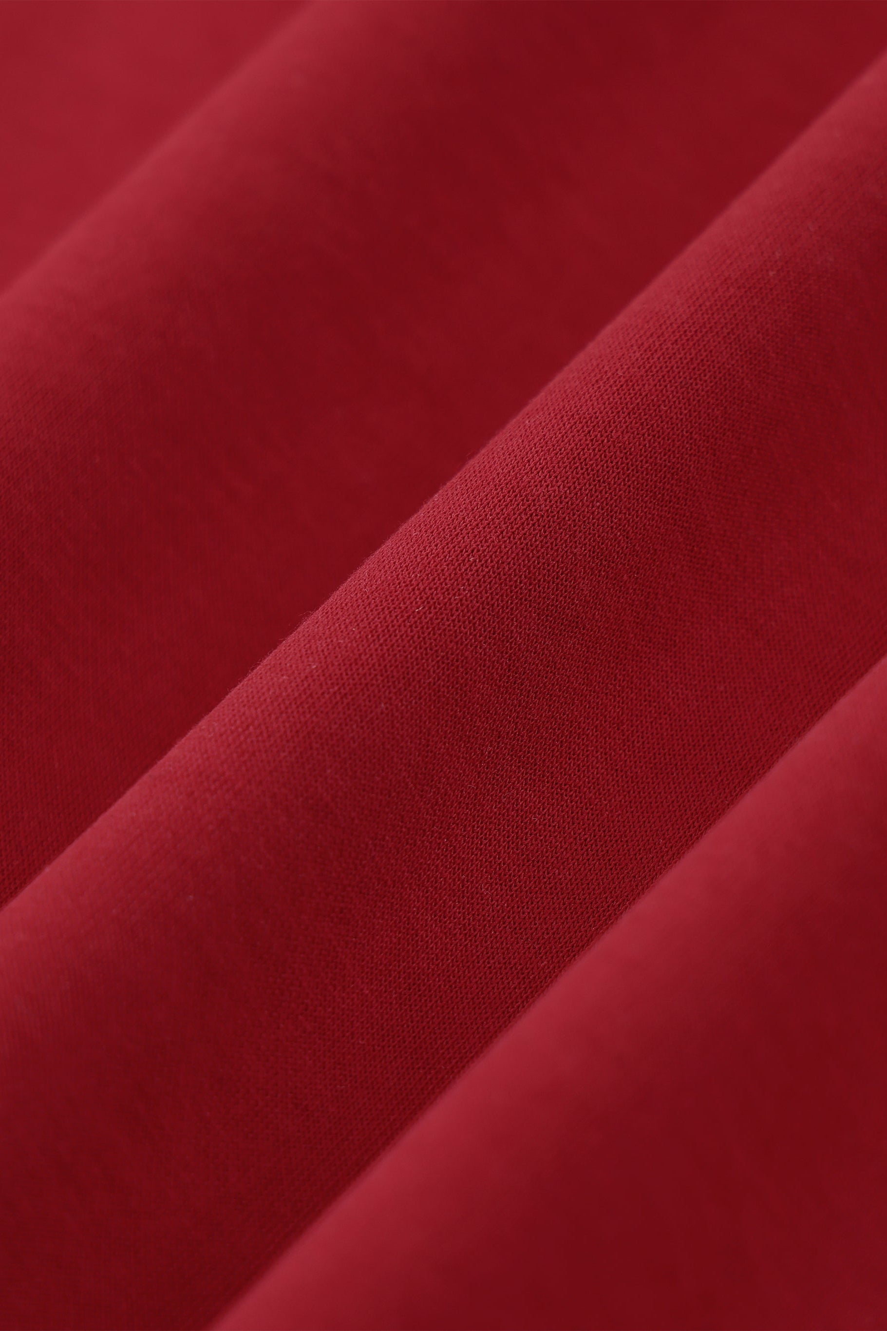 Close-up of red fabric with a textured surface
