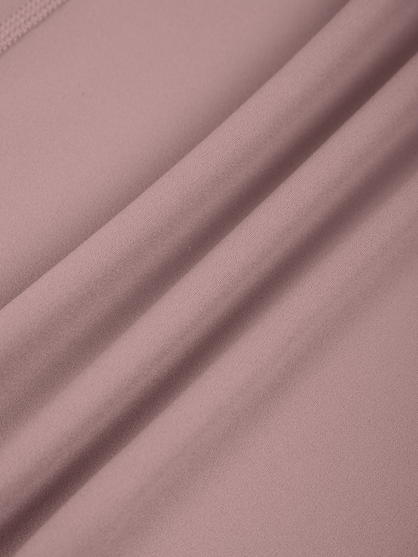 Close-up of pink fabric with folds