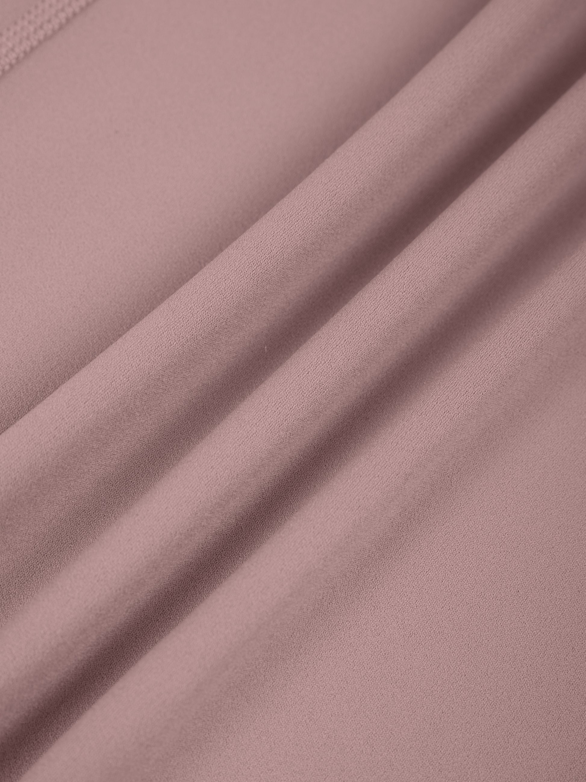 Close-up of pink fabric with folds