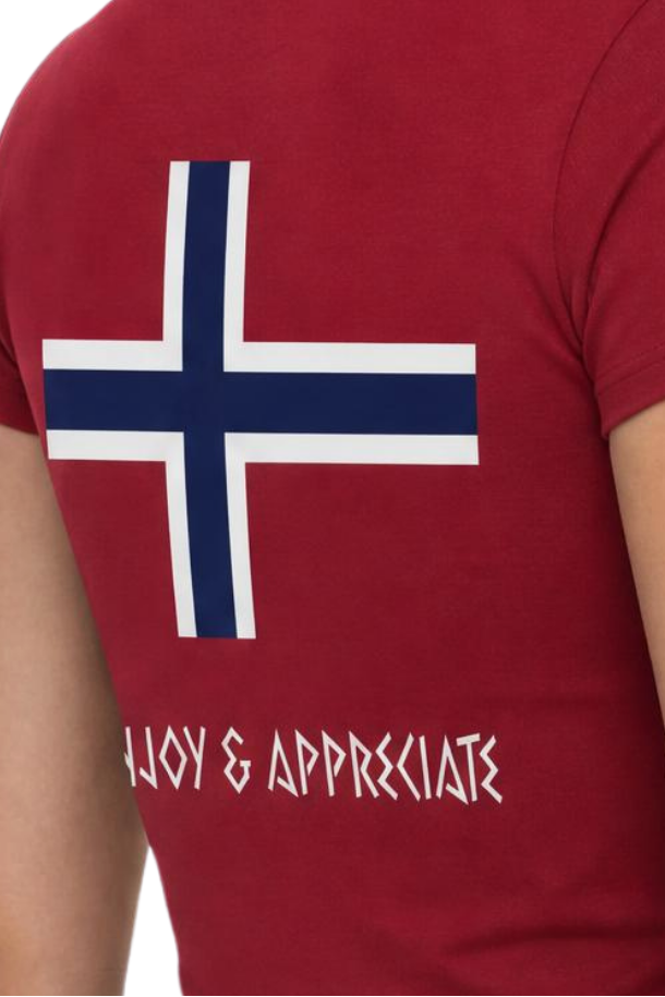 A woman wearing a red short-sleeve polo shirt with a large white and blue Norwegian flag printed on the back, plus white text reading 'ENJOY & APPRECIATE'. The photo is cropped to show the upper body and back against a white studio background.