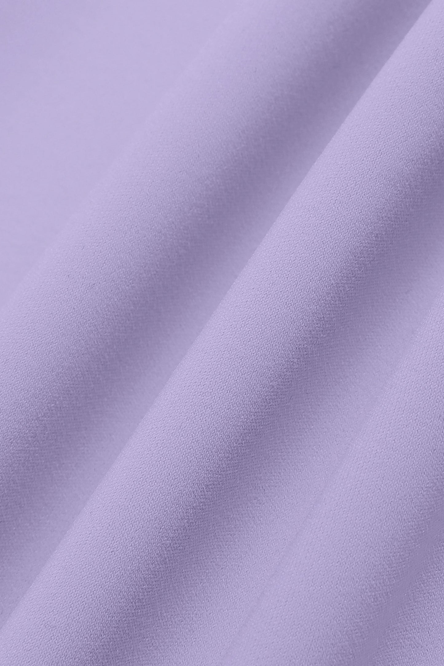 Close-up of purple fabric with folds