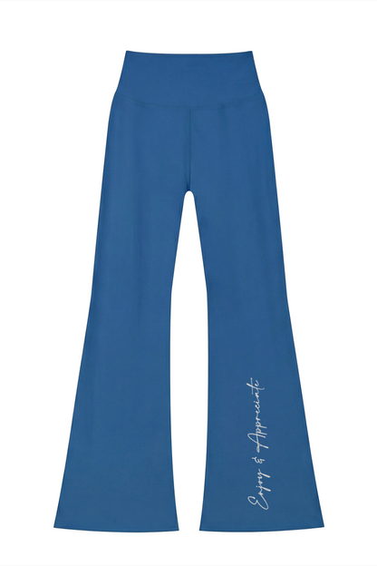 Blue high-waisted seamless flared leggings with a subtle white cursive inscription along the outer leg