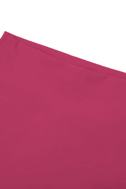 High-waisted seamless flared leggings in solid magenta fabric with smooth textured surface and neatly stitched hem