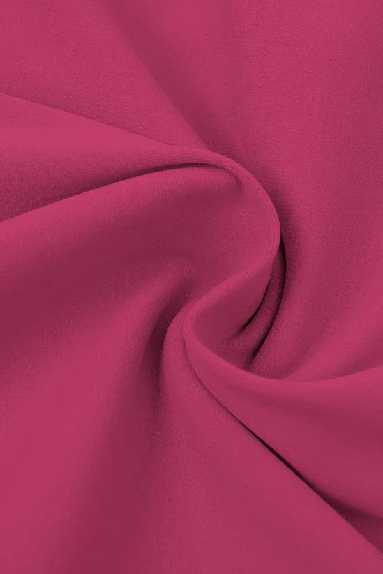 High-waisted seamless flared leggings in soft flowing fuchsia fabric with gentle folds and smooth texture