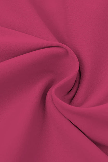 High-waisted seamless flared leggings in soft flowing fuchsia fabric with gentle folds and smooth texture