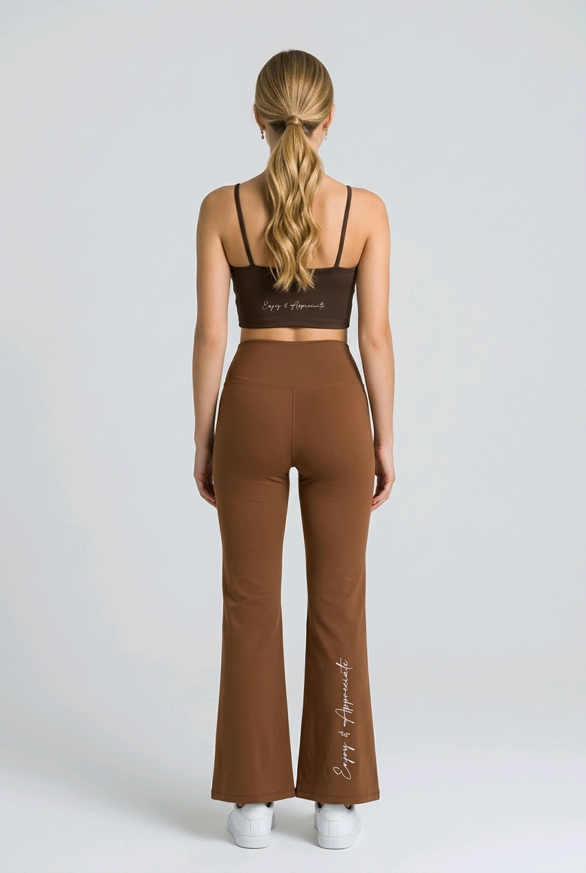 Brown high-waisted seamless flared leggings with white enjoy and appreciate embroidery on the back and side seam