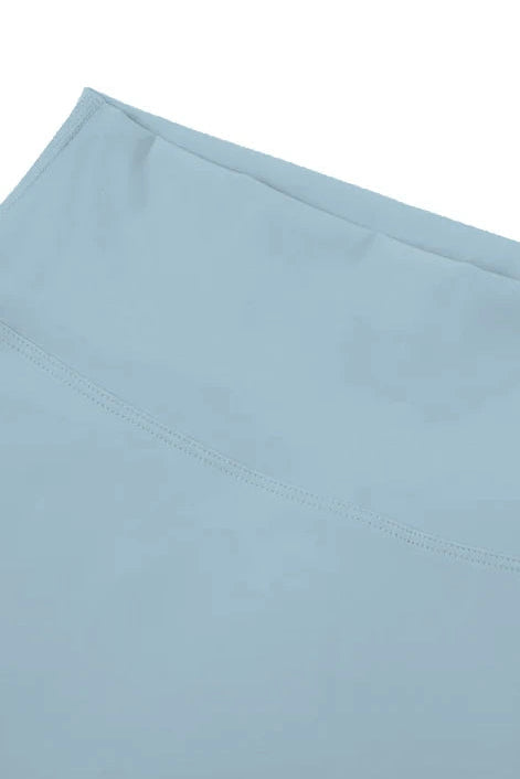 Light blue fabric with a subtle pattern on a white background