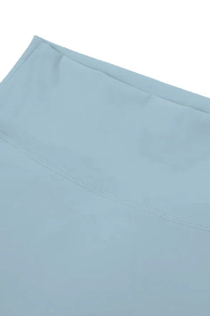 Light blue fabric with a subtle pattern on a white background