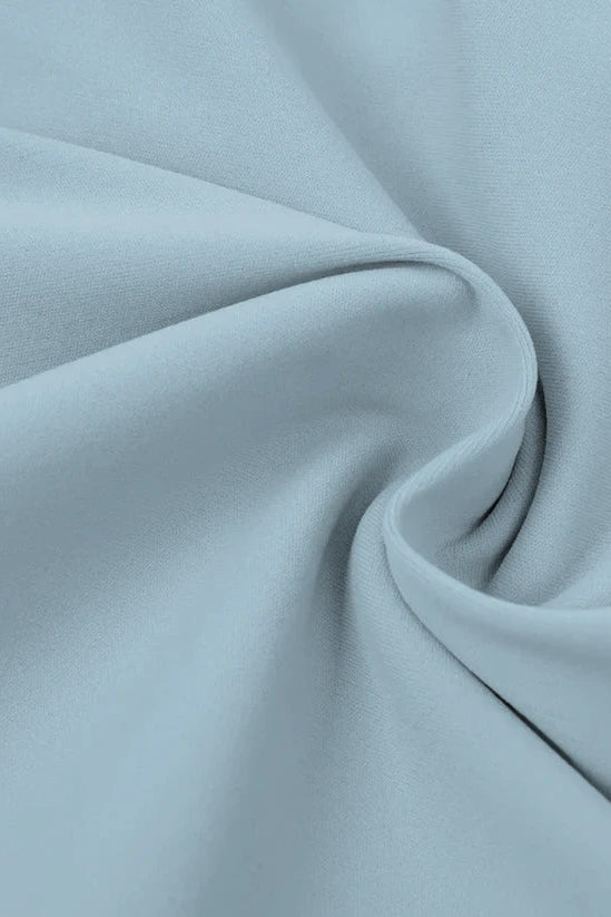 Close-up of light blue fabric with folds