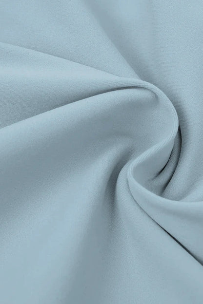 Close-up of light blue fabric with folds