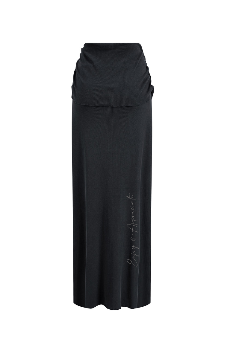 Black long skirt with a subtle pattern on a white background