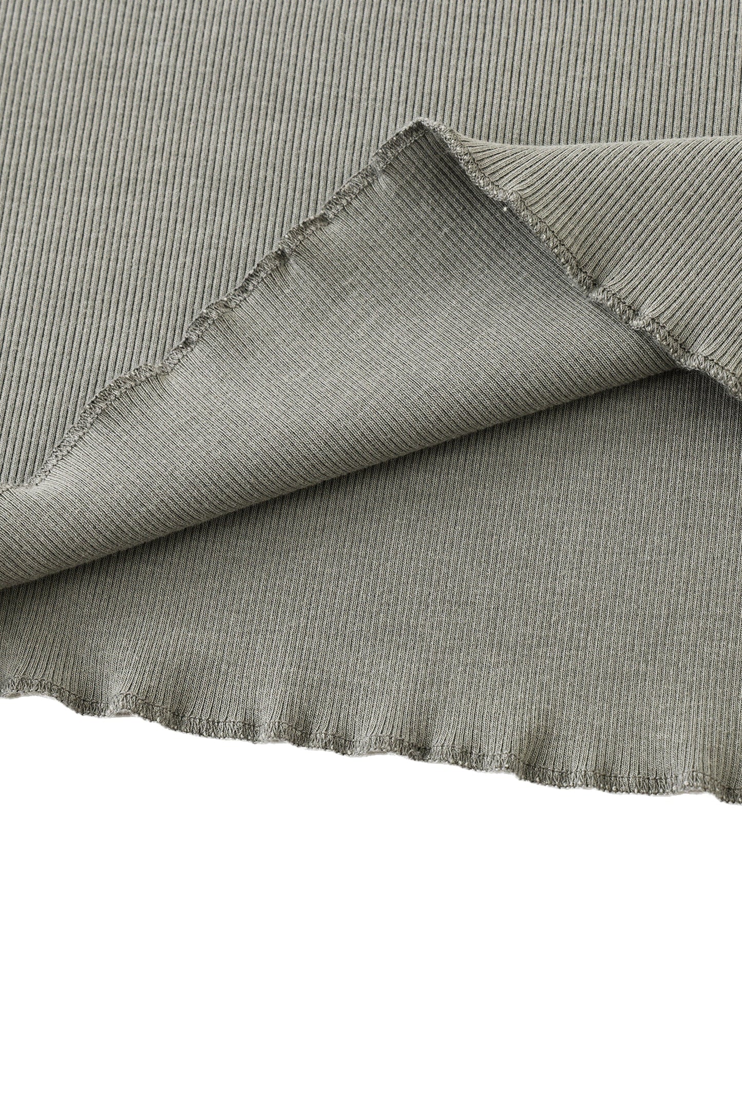 Close-up of textured gray fabric with a white background