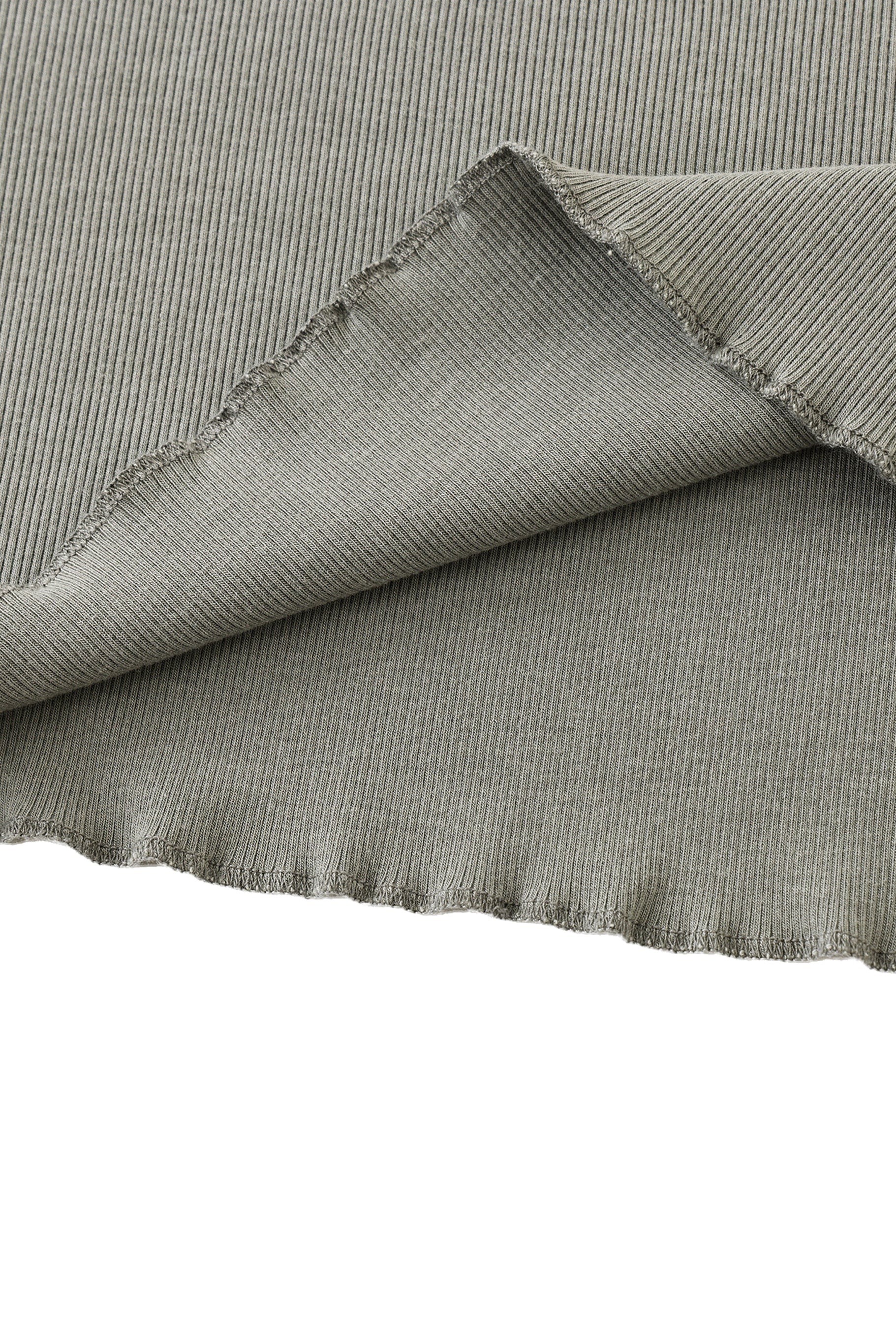 Close-up of textured gray fabric with a white background