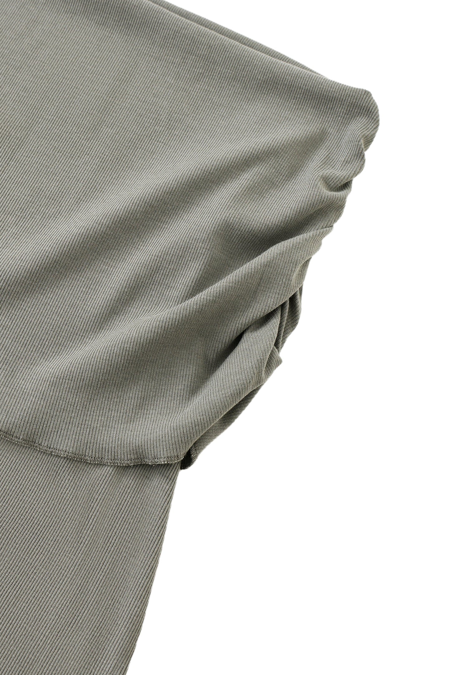 Close-up of a skirt waistband of gray fabric on a white background