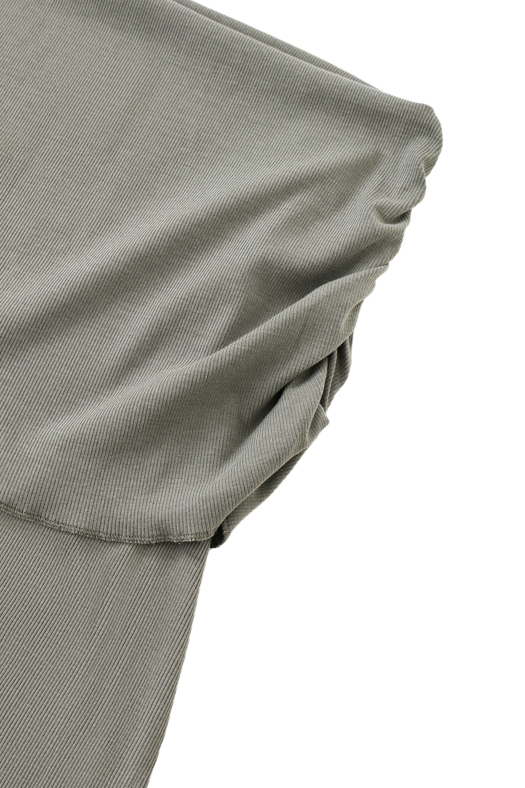 Close-up of a skirt waistband of gray fabric on a white background