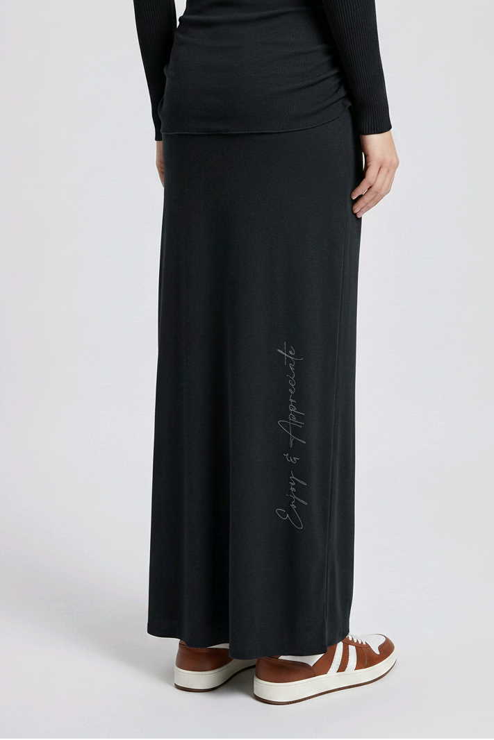 Black long skirt with enjoy & appreciate text on a white background